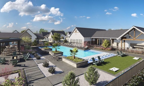 Aerial view of the pool at Foxtail by Banyan with lounge chairs and shaded cabana area at our brand new apartments in Austin.