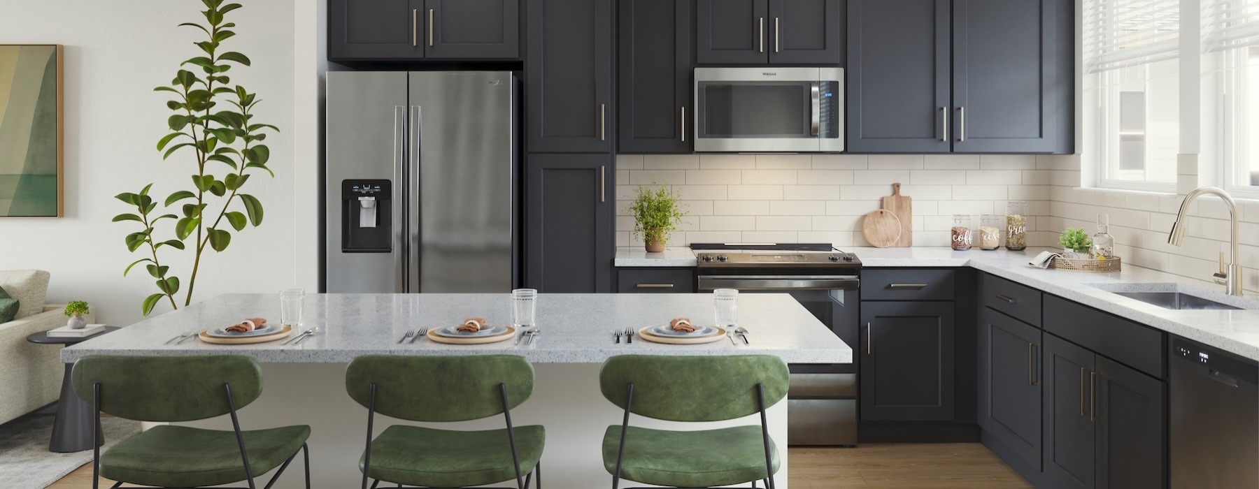 a kitchen with black cabinets and green chairs
