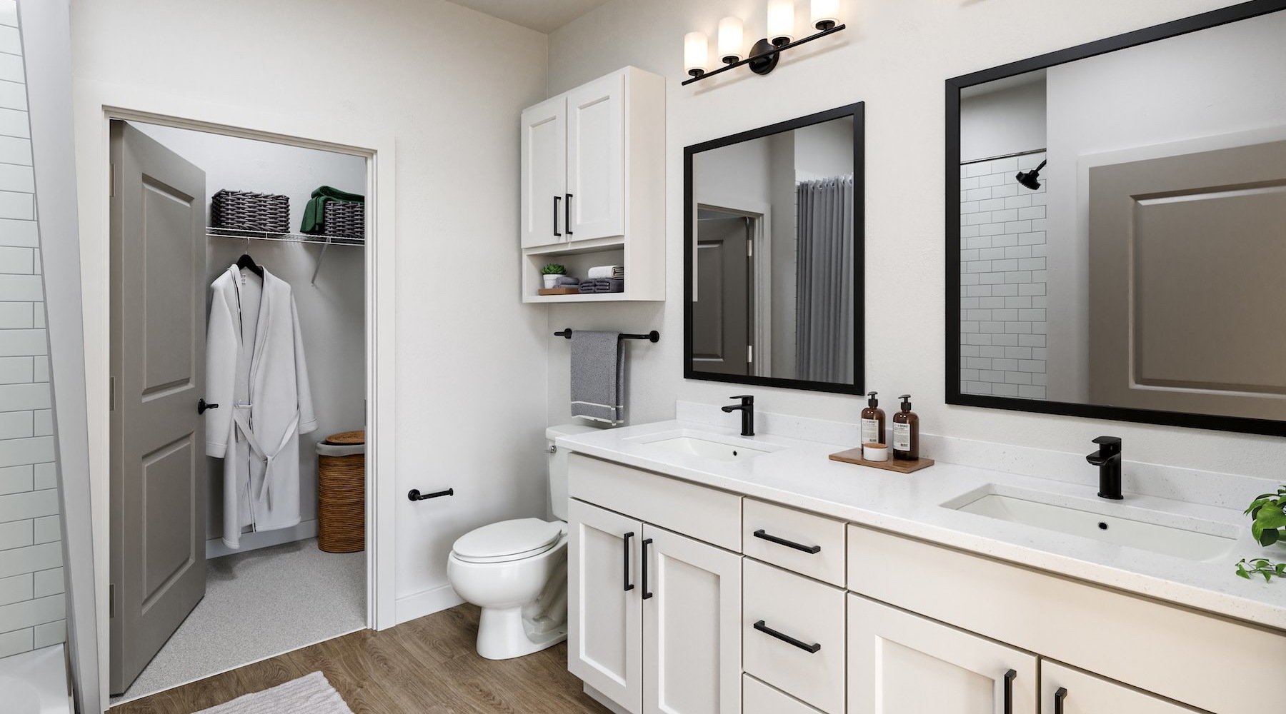 a bathroom with a toilet, sink and mirrors